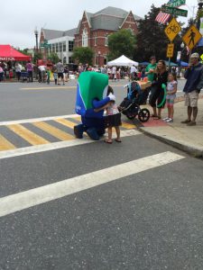 Mo hugging little girl at Natick Days