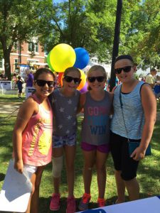 Girls hanging out at MutualOne Bank booth at Natick Days