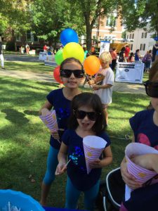 Girls eating snacks at Natick Days