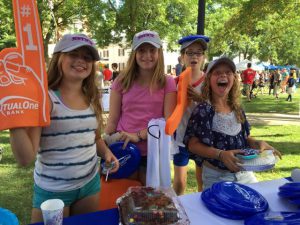 Girls having fun at MutualOne Bank booth at Natick Days