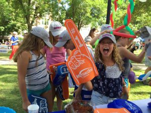 Girls having fun at MutualOne Bank booth at Natick Days