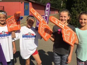 Girls at 20th George Wheeler Cup wearing MutualOne Bank foam fingers