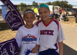 Girls at 20th George Wheeler Cup wearing MutualOne Bank foam fingers