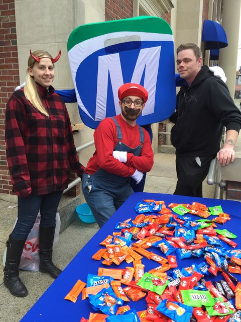 MutualOne Bank employees showing off their costumes at Natick Halloween Parade