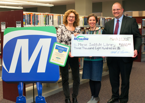 Morse Institute Library receives $3,800 donation from MutualOne Bank.
There were big smiles all around at the celebration of the Bank’s $3,800 donation to the Morse Institute Library. Pictured are: (l-r) Jane Finlay, library assistant director; Anna Litten, library community relations; and Greg Kennedy, MutualOne Bank vice president retail banking.