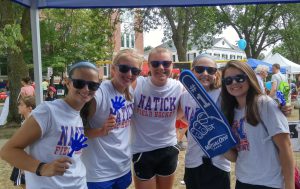 Young girls hanging out at MutualOne Bank's booth at Natick Days
