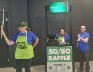 MutualOne Bank employees selling 50/50 raffle tickets at Boston Celtics game