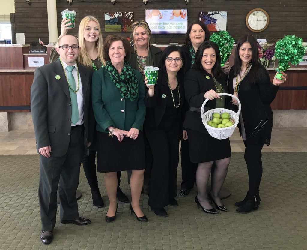 MutualOne Bank employees wearing green and St Patrick's Day attire