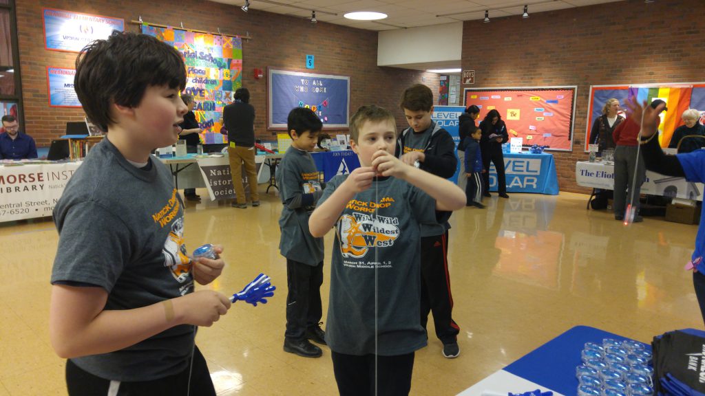 Child playing with yo-yo at Maple Magic Day