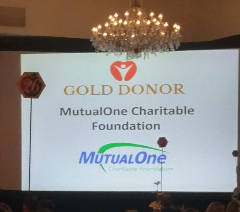 MutualOne Bank Charitable Foundation logo on big screen at AEFI Gala