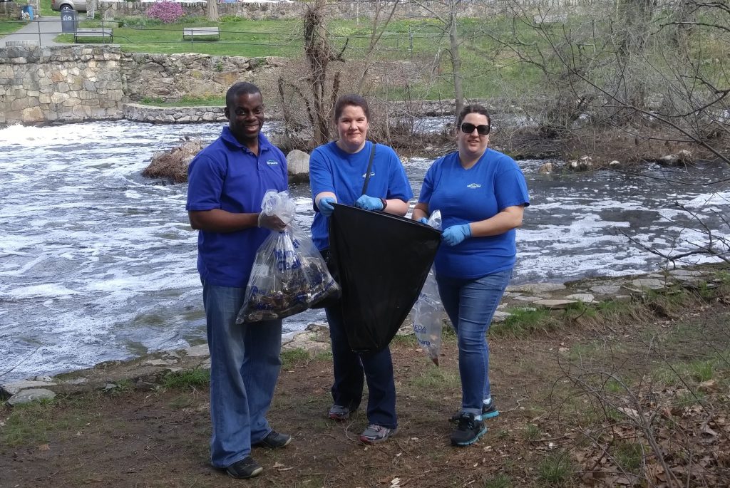 MutualOne Bank Employees in front of Charles River picking up trash