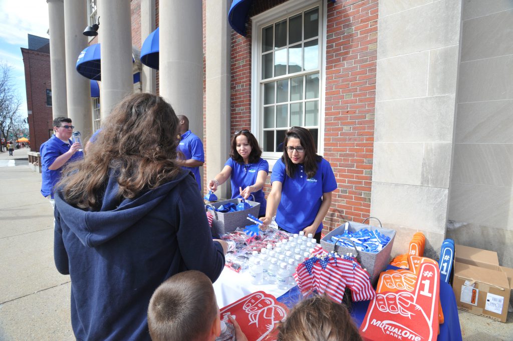 MutualOne Bank employees handing out giveaways