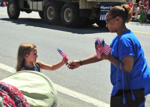 July 4th 2017 MutualOne employees flag to a girl