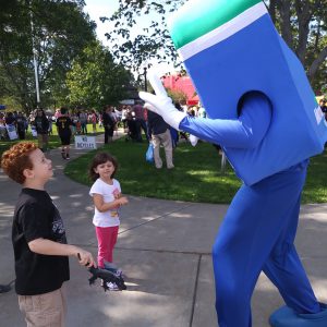 Natick Days Mo giving kids peace sign