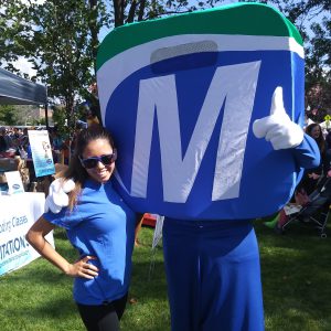 Natick Days Mo giving thumbs up with girl