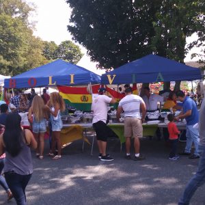 People standing at Bolivia tent