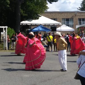 People wearing pink dancing in the street