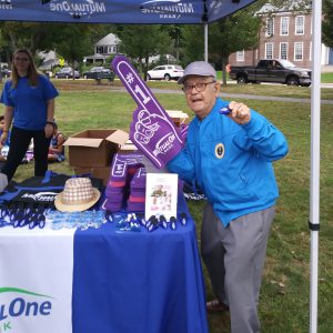 MetroWest Humane Society Craft Fair Man with large purple foam finger