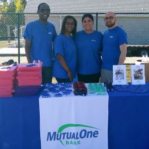 Four members of the MutualOne Bank team behind the table