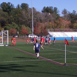 Soccer player wearing number eight walking onto the field