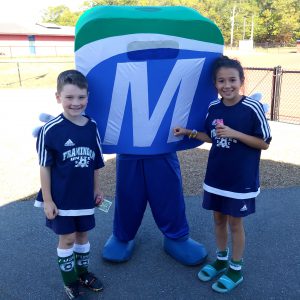 Mo with two kids wearing Framingham Soccer shirts