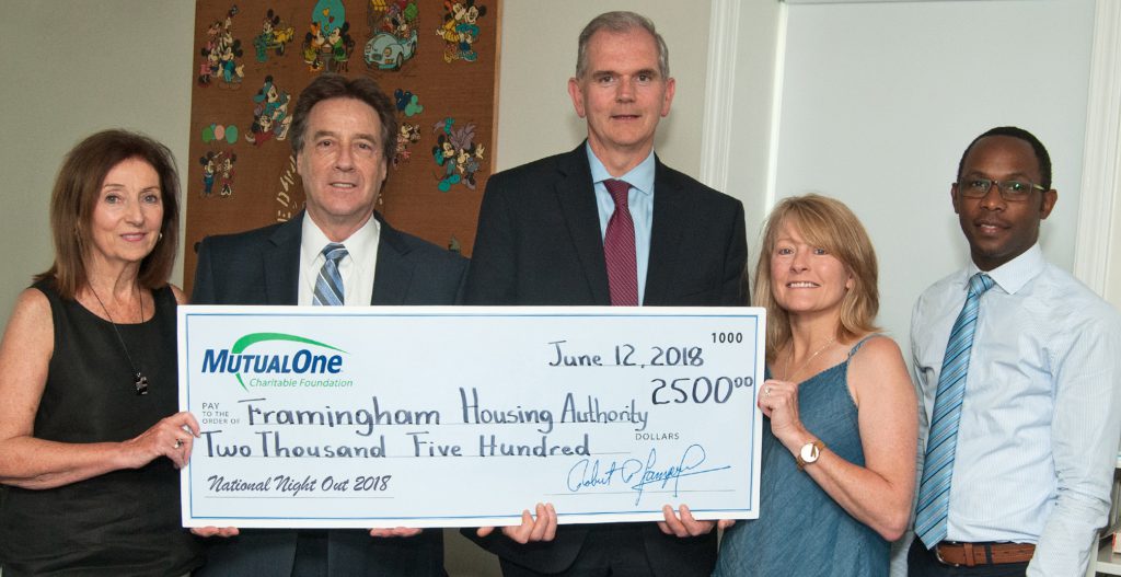 Celebrating MutualOne Charitable Foundation’s $2,500 grant to support National Night Out are (l-r) Janice Rogers, commissioner of the Framingham Housing Authority; Mark Haranas, president and CEO of MutualOne Bank; Paul Landers, executive director and Janet Leombruno, commissioner of the Framingham Housing Authority; and Yves Munyankindi, retail support & charitable foundation administrator at MutualOne Bank.
