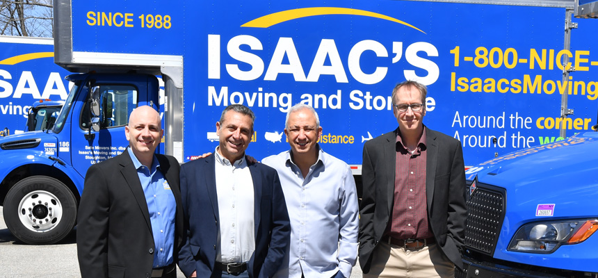 Four men pin front of Isaac's moving truck