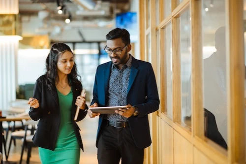 Business people consulting in hallway