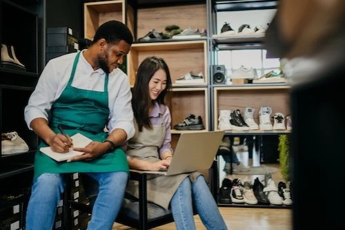 Cafe owners looking at a computer