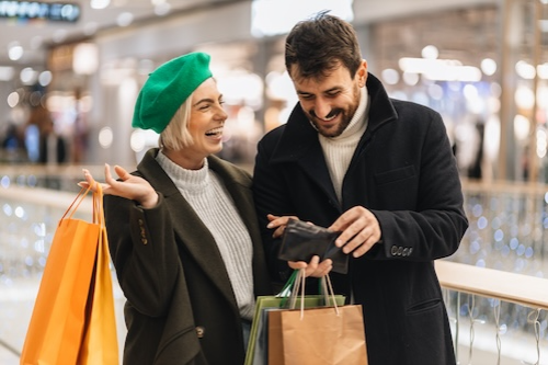 Couple holding cash