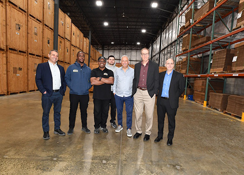 Isaac's Moving team pictured in warehouse.