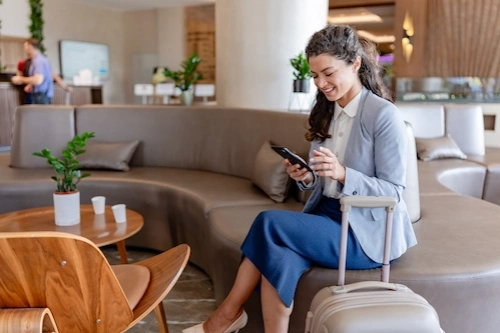 Business traveler looking at phone