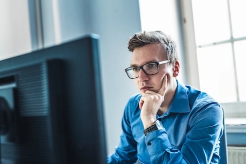 Business owner looking at a computer screen