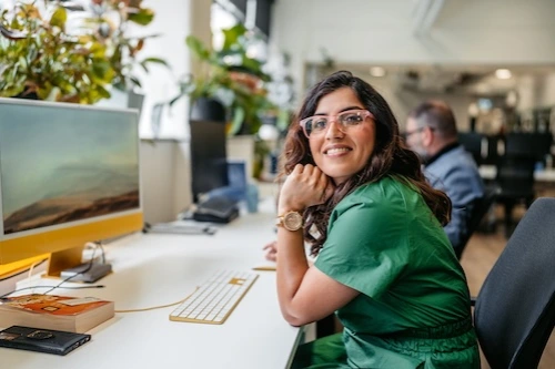 Woman sitting at a desktop computer
