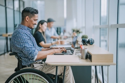 Wheelchair user working at a desk