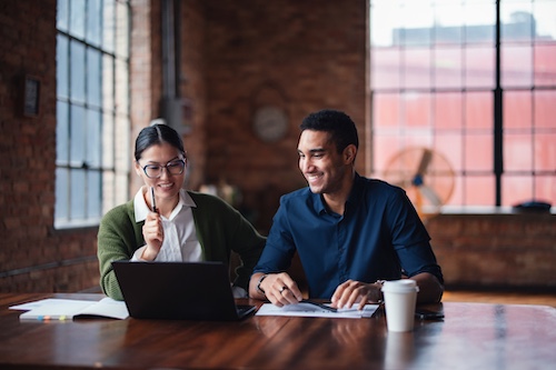 Two people speaking together