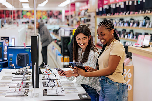 Two people shopping for computers.
